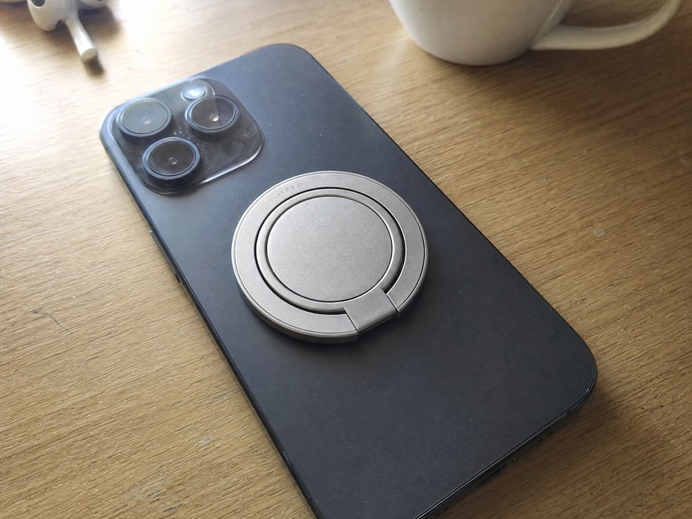 Customer photo of the ring grip on a black phone.
